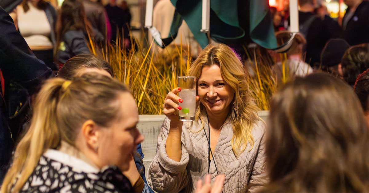Guests rate their likelihood to recommend at an average of 9.7 out of 10, with a recent Net Promoter Score of +100 based on post-event feedback. Image of corporate client.