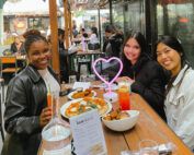 Love Island 2026 watch party on Union Square photo of girl group enjoying food and cocktails outdoors.